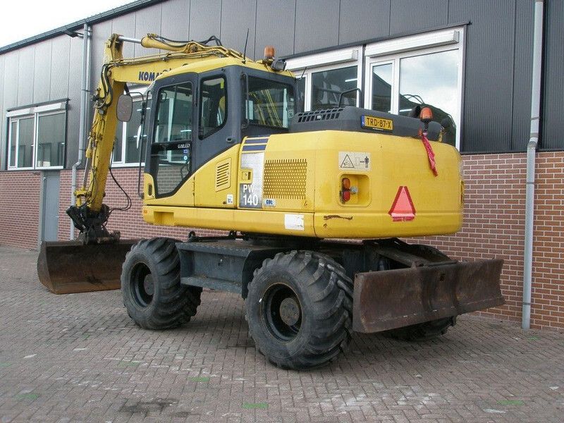 2008 Komatsu PW140-7 wheel excavator, rear three-quarter view 2008 Komatsu PW140-7 wheel excavator, rear three-quarter view