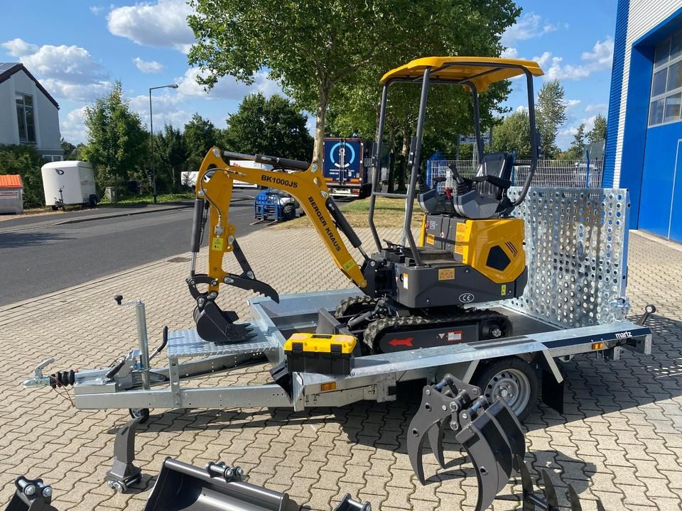 Berger Kraus BK1000JS mini excavator on a trailer, side view Berger Kraus BK1000JS mini excavator on a trailer, side view