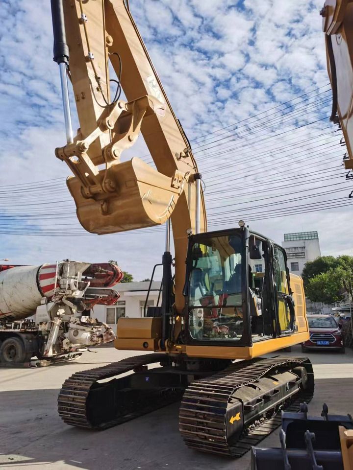 2022 Caterpillar 320GC crawler excavator, front three-quarter view