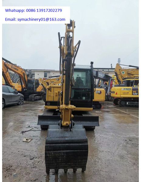 2023 Caterpillar 305.5E2 mini excavator, front view 2023 Caterpillar 305.5E2 mini excavator, front view
