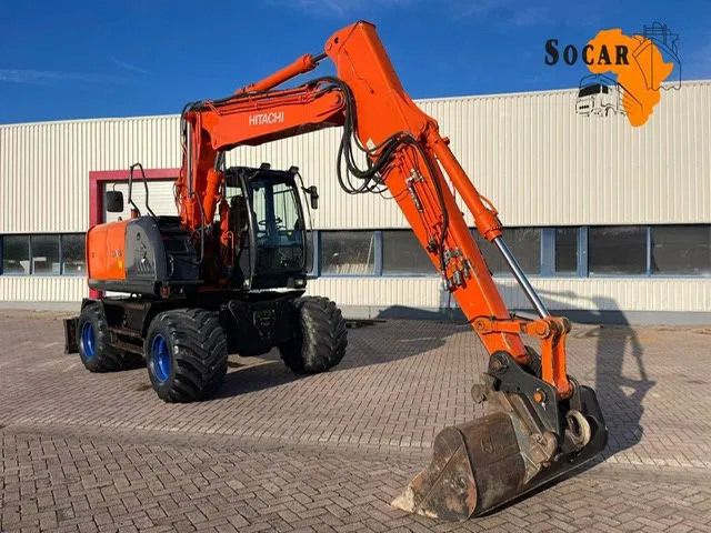 2011 Hitachi ZX140W-3 wheel excavator, side view 2011 Hitachi ZX140W-3 wheel excavator, side view