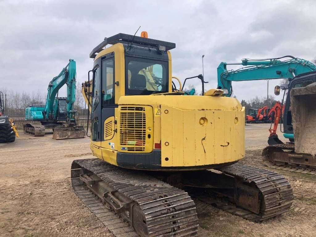 2011 Komatsu PC138US-8 crawler excavator, rear three-quarter view 2011 Komatsu PC138US-8 crawler excavator, rear three-quarter view