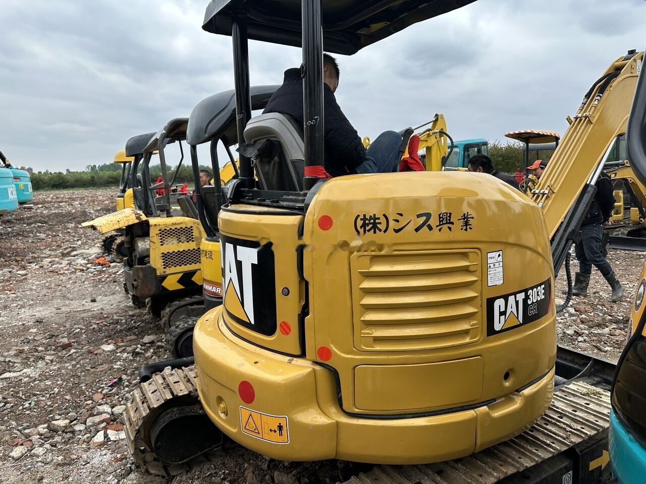 Caterpillar 303E CR mini excavator rear view Caterpillar 303E CR mini excavator rear view