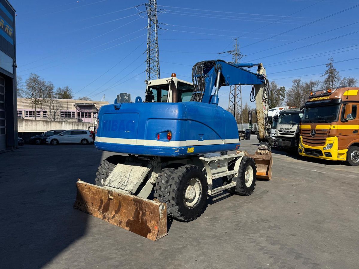 2015 Caterpillar M313D wheel excavator, rear three-quarter view 2015 Caterpillar M313D wheel excavator, rear three-quarter view
