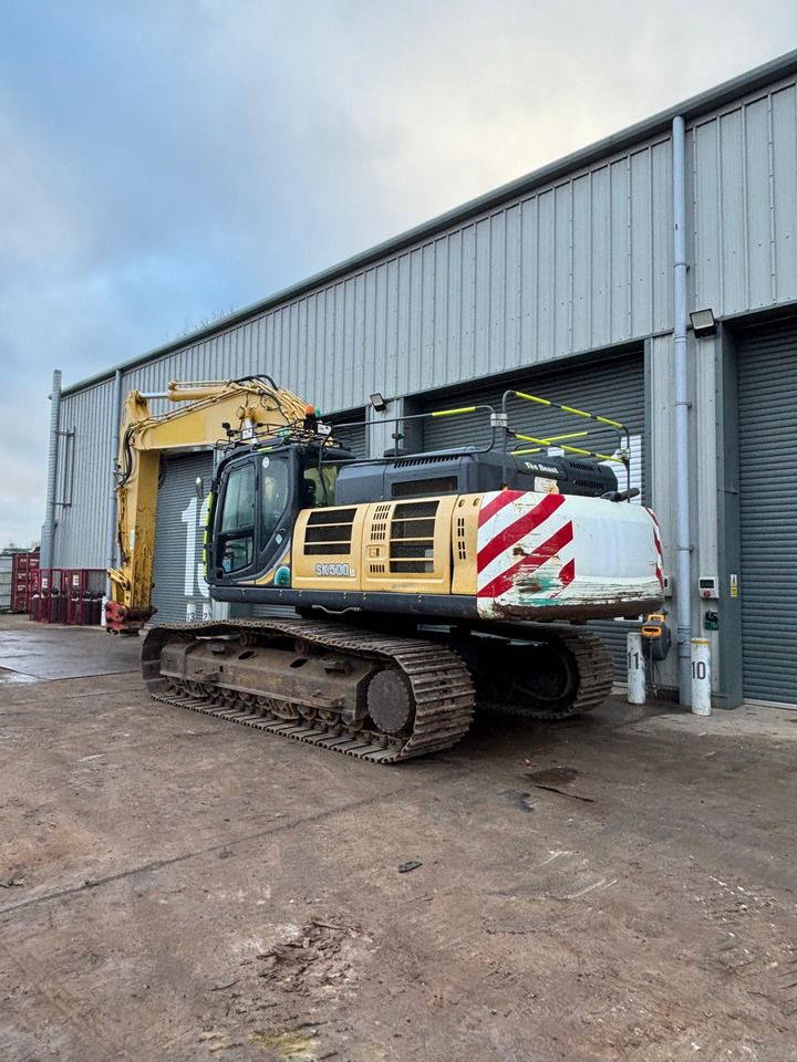 2019 Kobelco SK500LC-10 crawler excavator, rear three-quarter view 2019 Kobelco SK500LC-10 crawler excavator, rear three-quarter view
