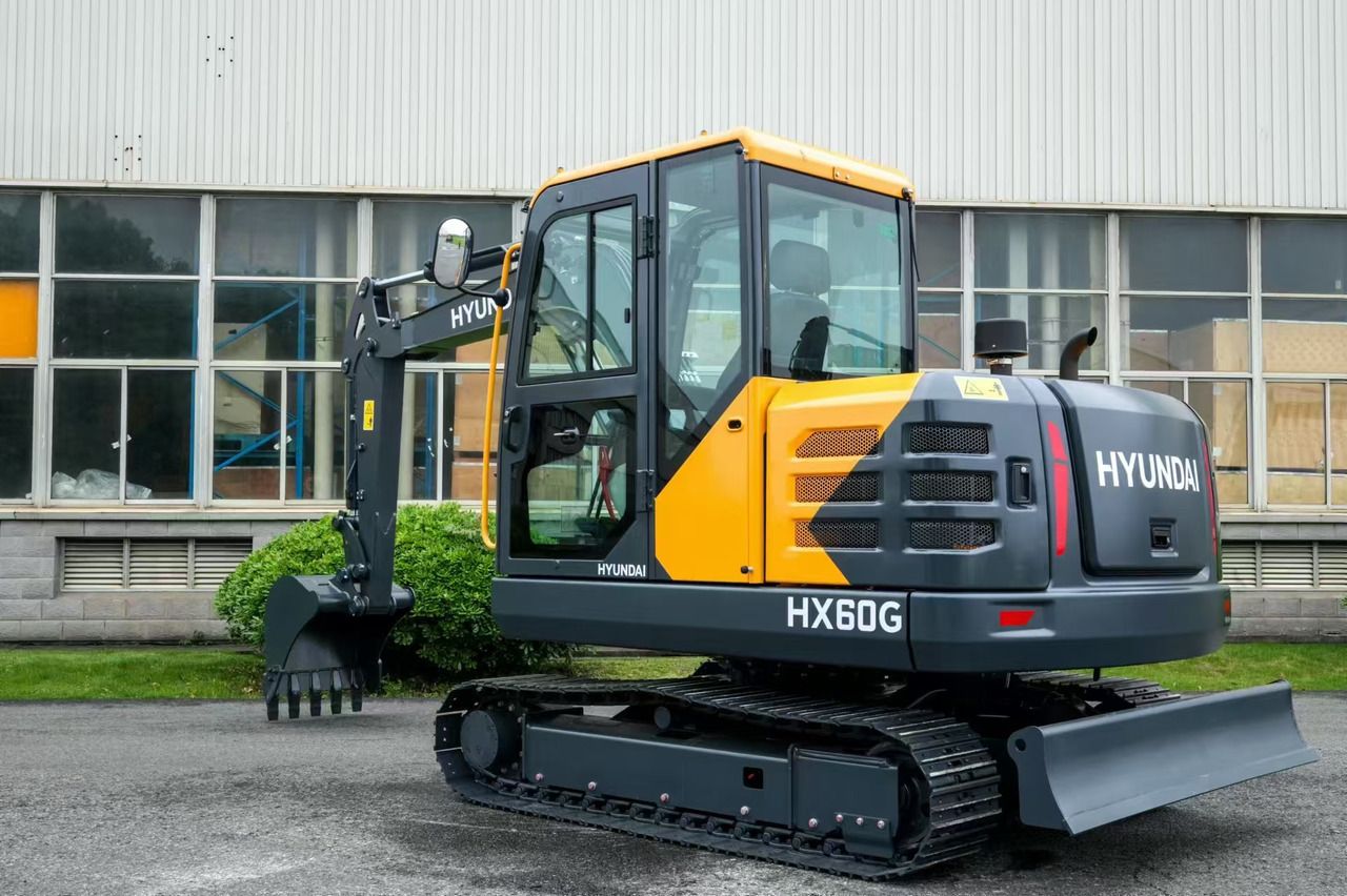 2026 Hyundai HX60G mini excavator, rear three-quarter view 2026 Hyundai HX60G mini excavator, rear three-quarter view