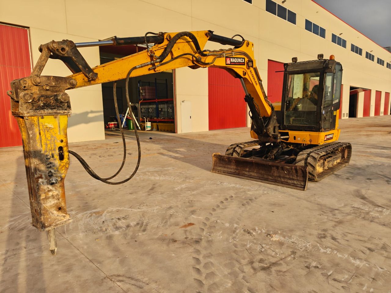 2019 JCB 85Z mini excavator with hydraulic breaker attachment, side view