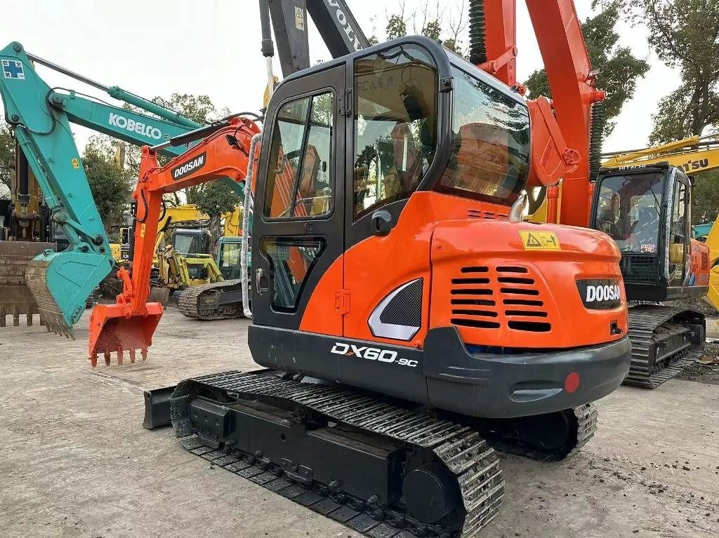 2022 Doosan DX60-9C mini excavator, rear three-quarter view 2022 Doosan DX60-9C mini excavator, rear three-quarter view