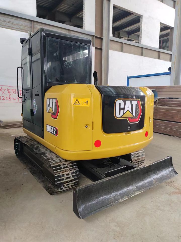2022 Caterpillar 306E2 mini excavator, rear three-quarter view 2022 Caterpillar 306E2 mini excavator, rear three-quarter view