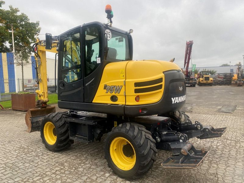 2021 Yanmar B95W wheel excavator, rear three-quarter view 2021 Yanmar B95W wheel excavator, rear three-quarter view