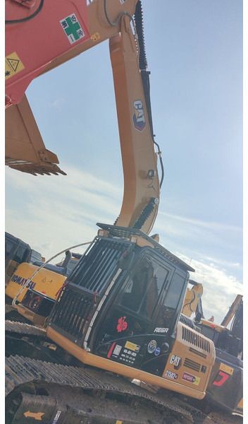 2023 Caterpillar 315D2 crawler excavator, side view of cab and boom 2023 Caterpillar 315D2 crawler excavator, side view of cab and boom