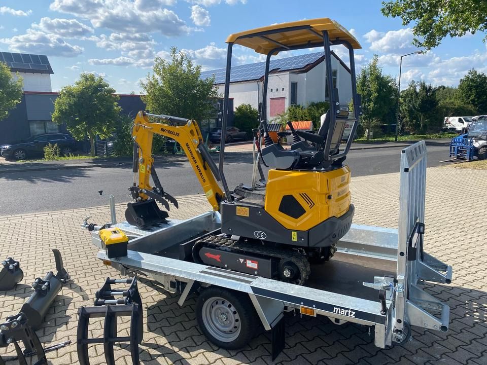 Berger Kraus BK1000JS mini excavator on a trailer, side view Berger Kraus BK1000JS mini excavator on a trailer, side view