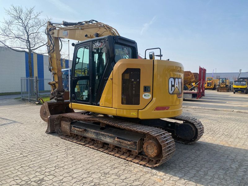 2021 Caterpillar 315GC crawler excavator, rear three-quarter view 2021 Caterpillar 315GC crawler excavator, rear three-quarter view