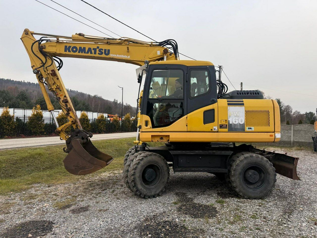 2009 Komatsu PW160-7E0 wheel excavator side view 2009 Komatsu PW160-7E0 wheel excavator side view