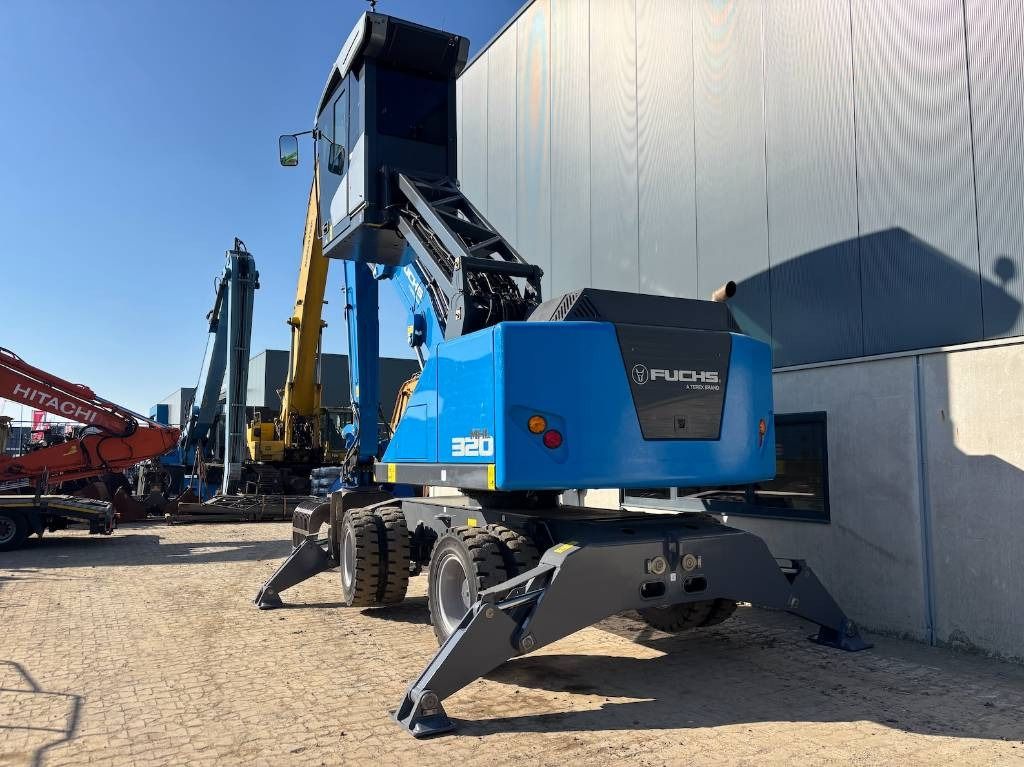2022 Fuchs MHL320F material handler, rear three-quarter view 2022 Fuchs MHL320F material handler, rear three-quarter view