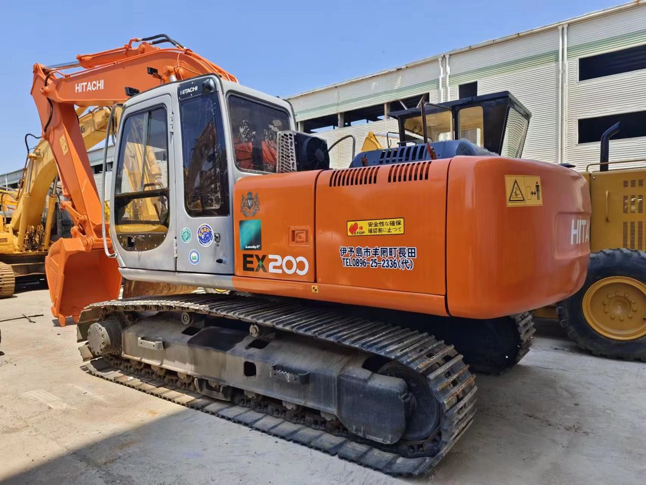2016 Hitachi EX200-5 crawler excavator, rear three-quarter view 2016 Hitachi EX200-5 crawler excavator, rear three-quarter view