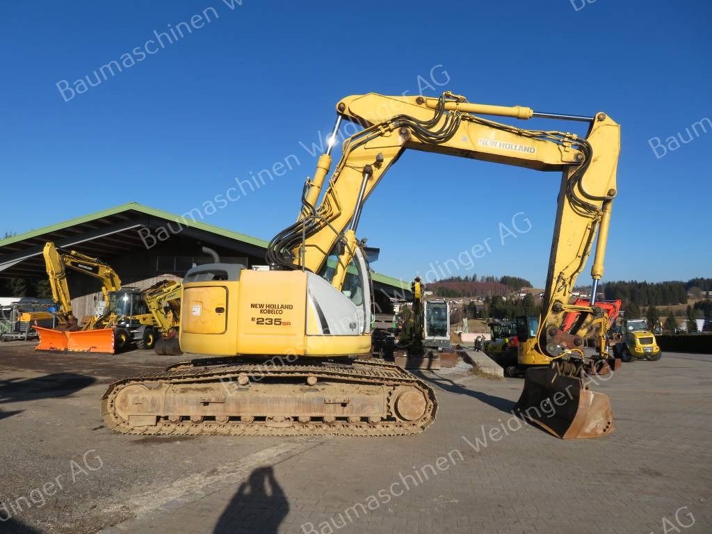 2009 New Holland E235BSR-2 crawler excavator, side view 2009 New Holland E235BSR-2 crawler excavator, side view