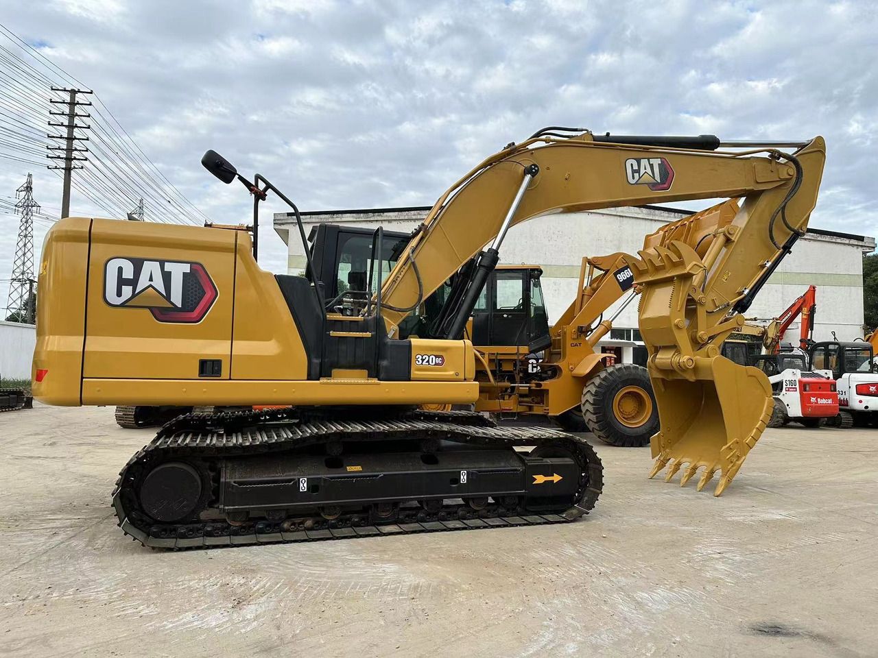 2022 Caterpillar 320GC crawler excavator, side view