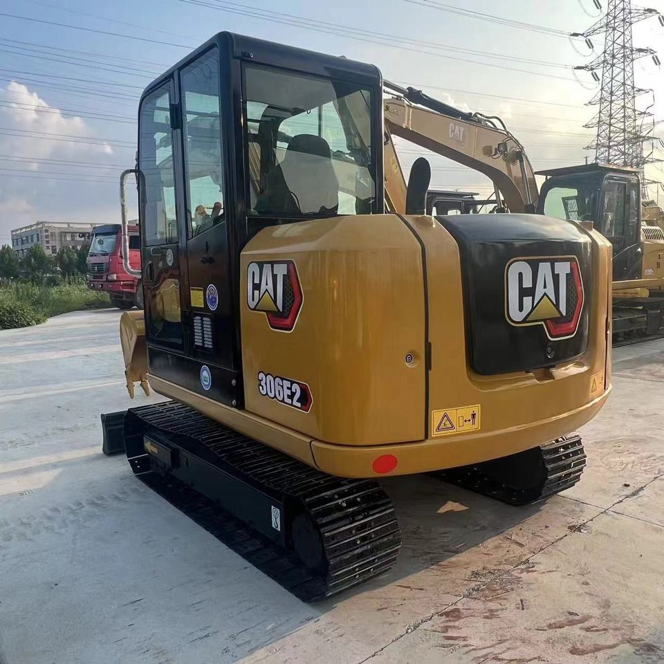 2023 Caterpillar 306E2 mini excavator, rear three-quarter view