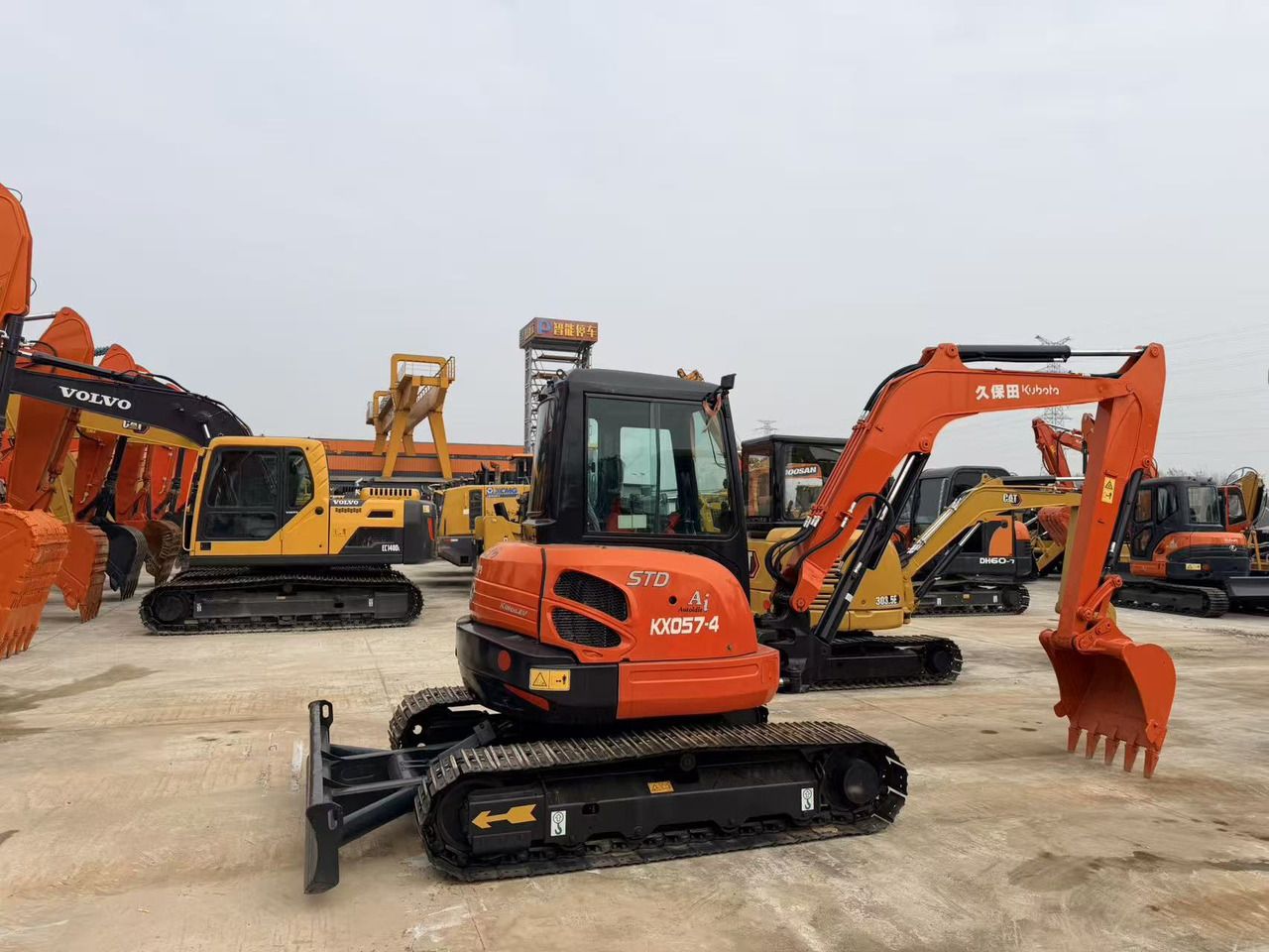2022 Kubota KX057-4 mini excavator, front three-quarter view 2022 Kubota KX057-4 mini excavator, front three-quarter view