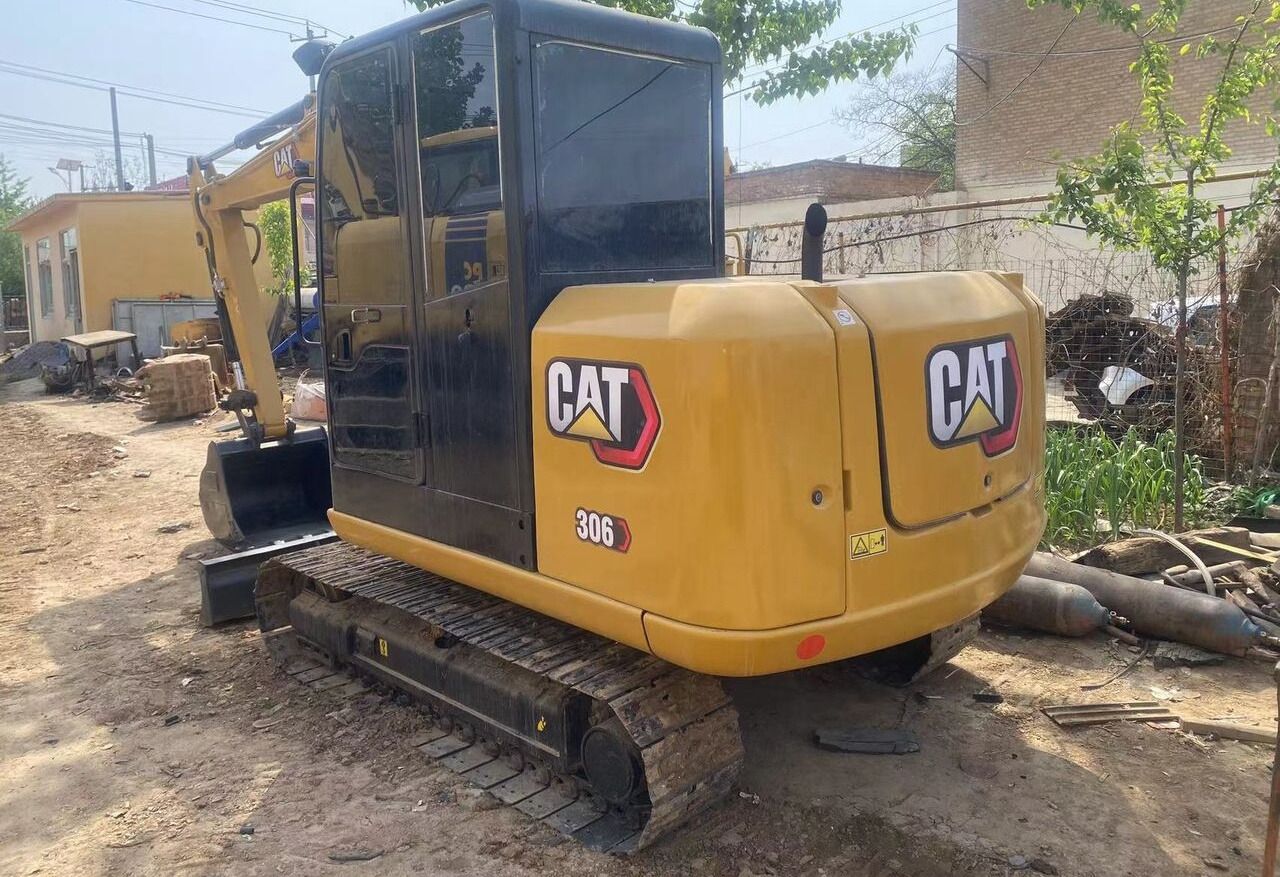 Caterpillar 306D mini excavator, rear three-quarter view Caterpillar 306D mini excavator, rear three-quarter view