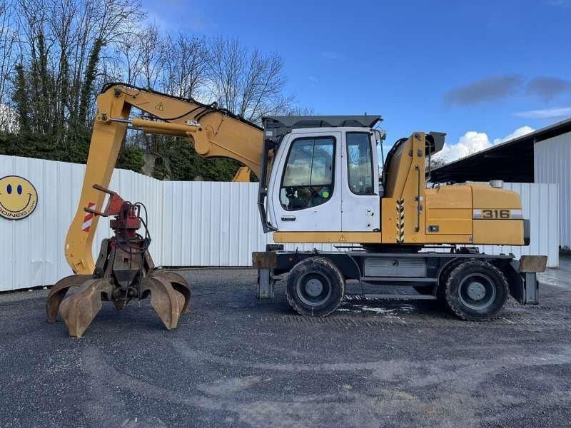 2012 Liebherr 316 material handler, side view 2012 Liebherr 316 material handler, side view