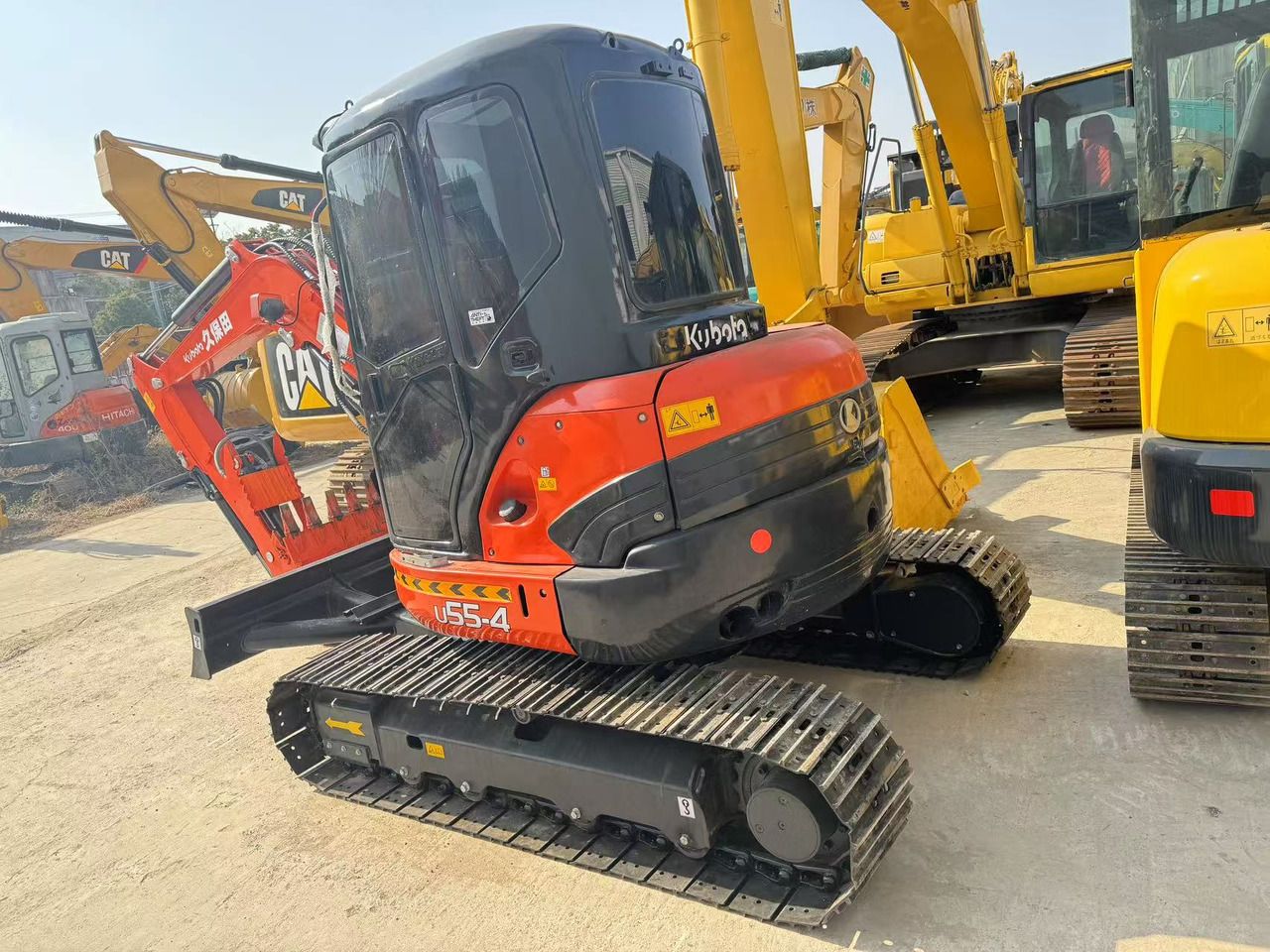 2022 Kubota U55-4 mini excavator, rear three-quarter view
