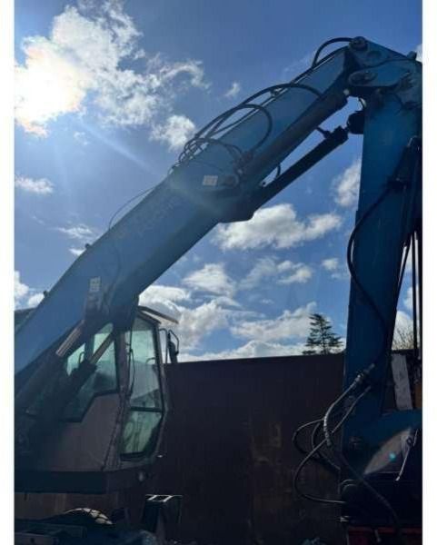 2010 Fuchs MHL320 material handler, side view of boom and cab 2010 Fuchs MHL320 material handler, side view of boom and cab