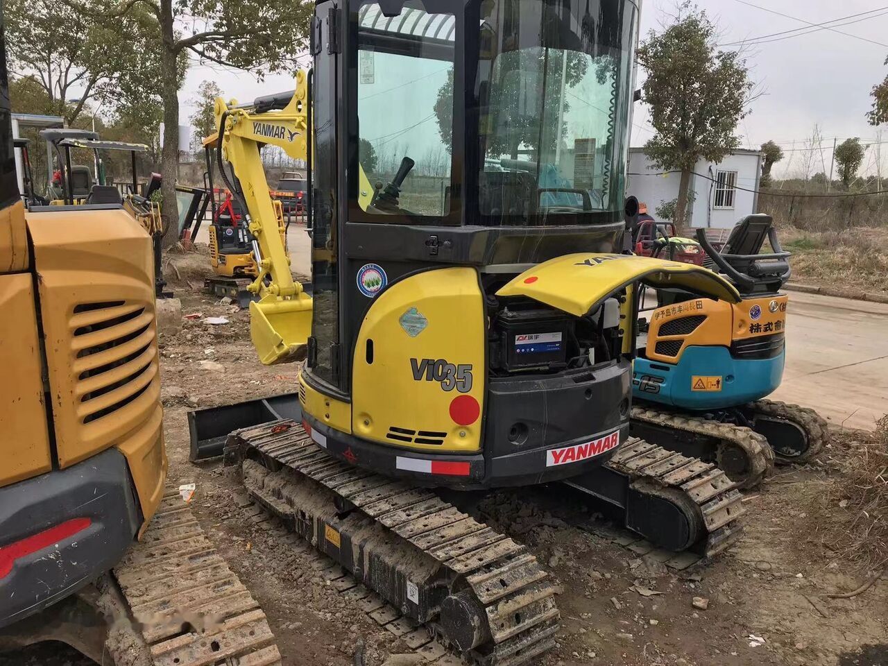 2022 Yanmar VIO35 mini excavator, side view with open engine compartment 2022 Yanmar VIO35 mini excavator, side view with open engine compartment