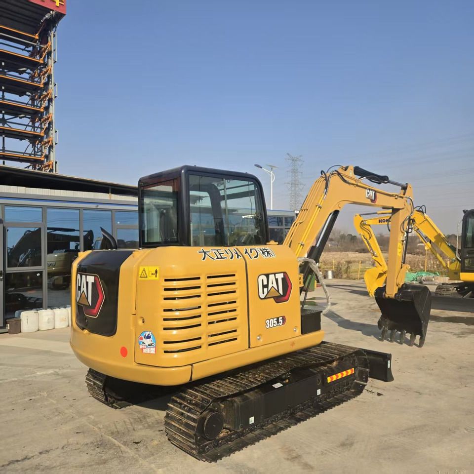 2024 Caterpillar 305.5 mini excavator, rear three-quarter view