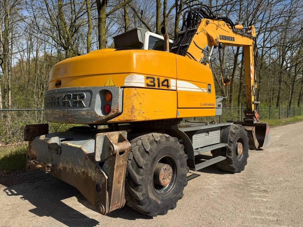 2008 Liebherr A314 LITRONIC wheel excavator, rear three-quarter view 2008 Liebherr A314 LITRONIC wheel excavator, rear three-quarter view