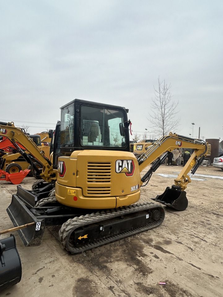 2023 Caterpillar 303.5ECR mini excavator, rear three-quarter view