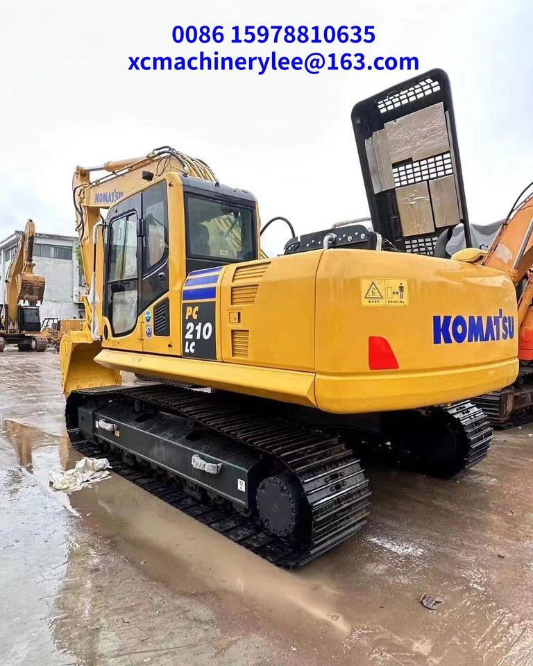 2023 Komatsu PC210LC crawler excavator, rear three-quarter view 2023 Komatsu PC210LC crawler excavator, rear three-quarter view