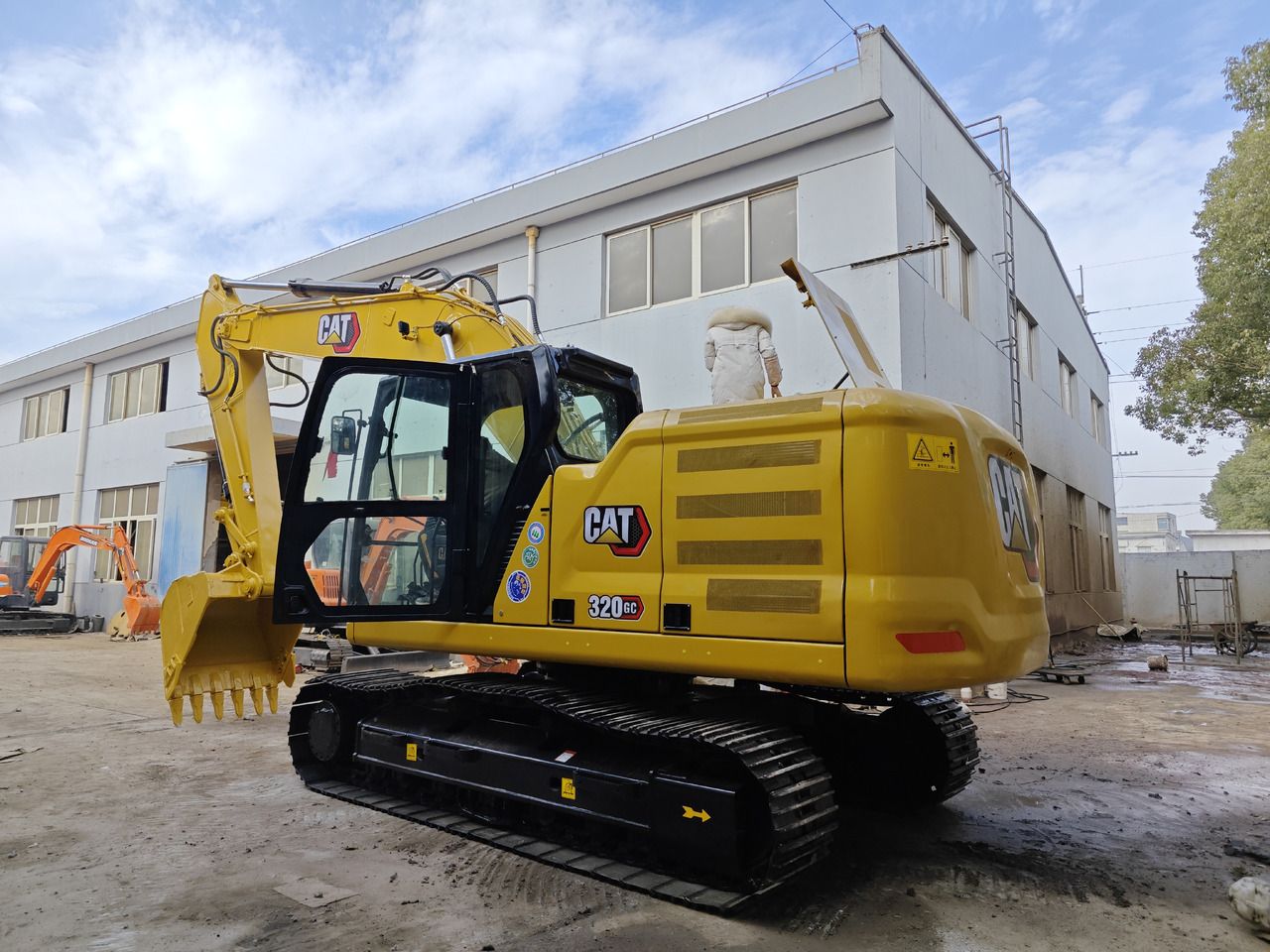 Caterpillar 320GC crawler excavator, rear three-quarter view