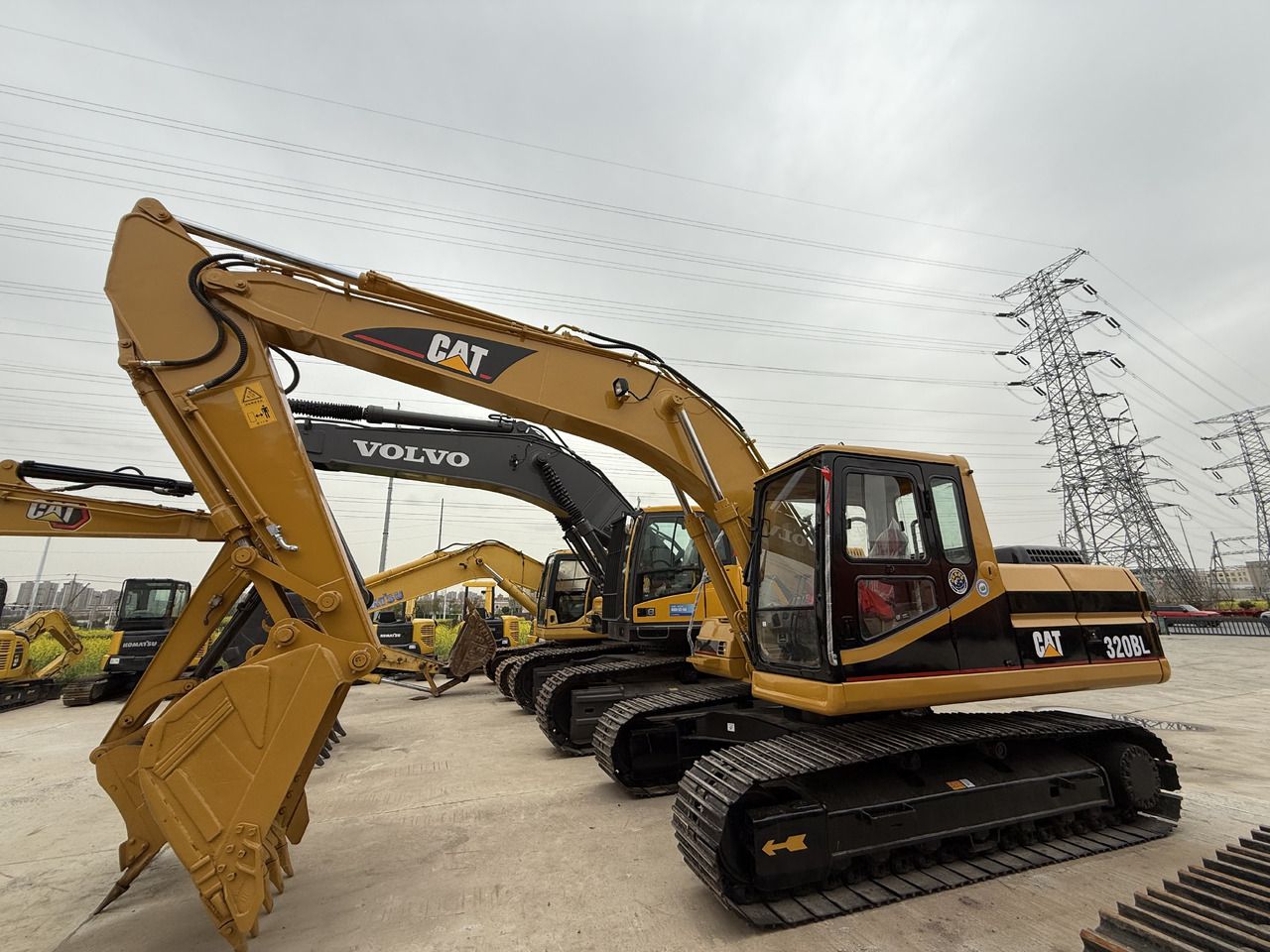 2022 Caterpillar 320BL crawler excavator, side view