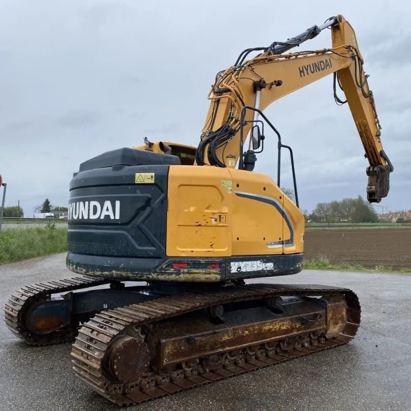 Hyundai 235 crawler excavator, rear three-quarter view Hyundai 235 crawler excavator, rear three-quarter view