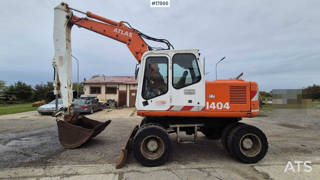 1995 Atlas 1404 wheel excavator side view