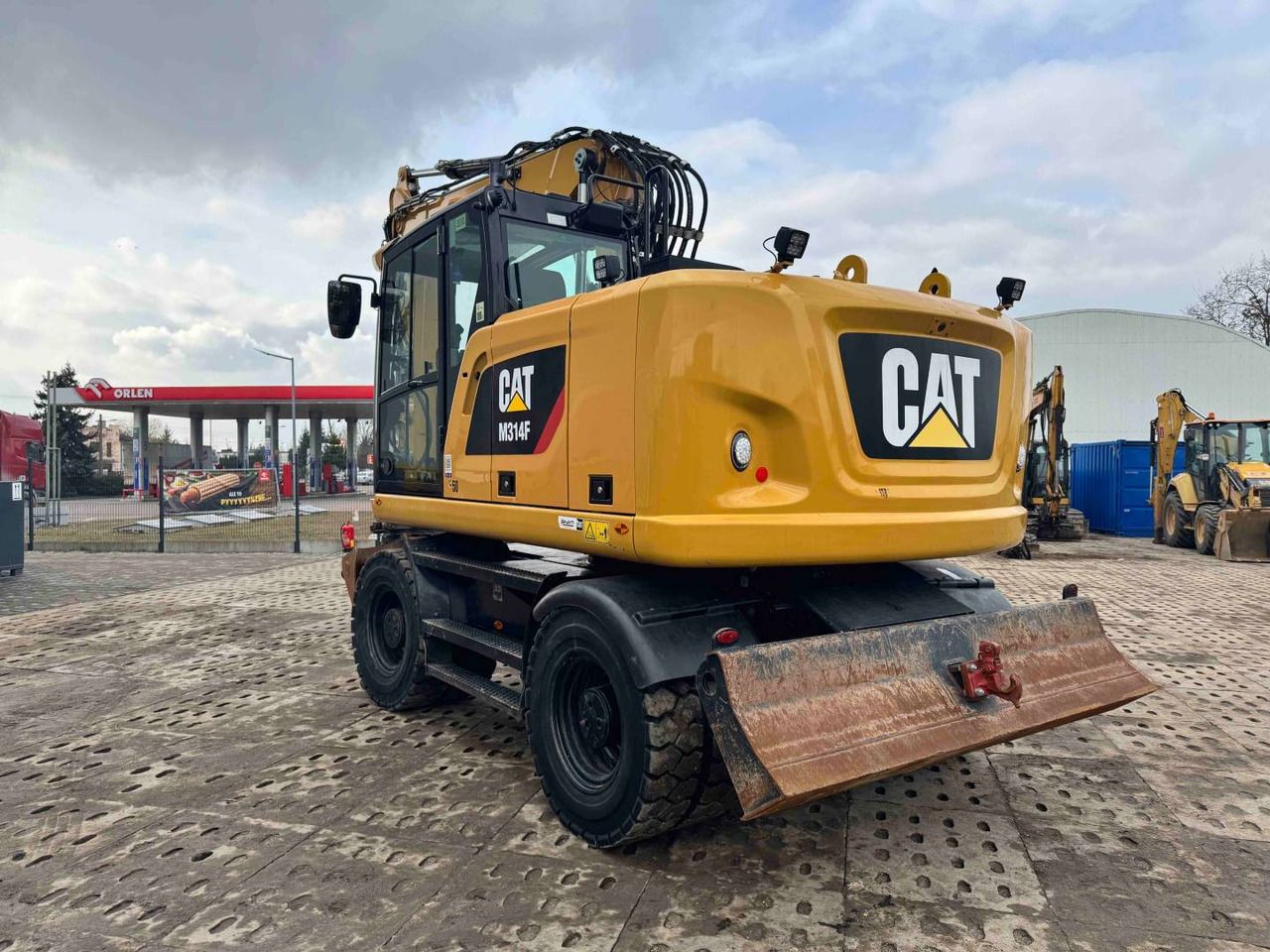 2019 Caterpillar M314F wheel excavator rear three-quarter view 2019 Caterpillar M314F wheel excavator rear three-quarter view