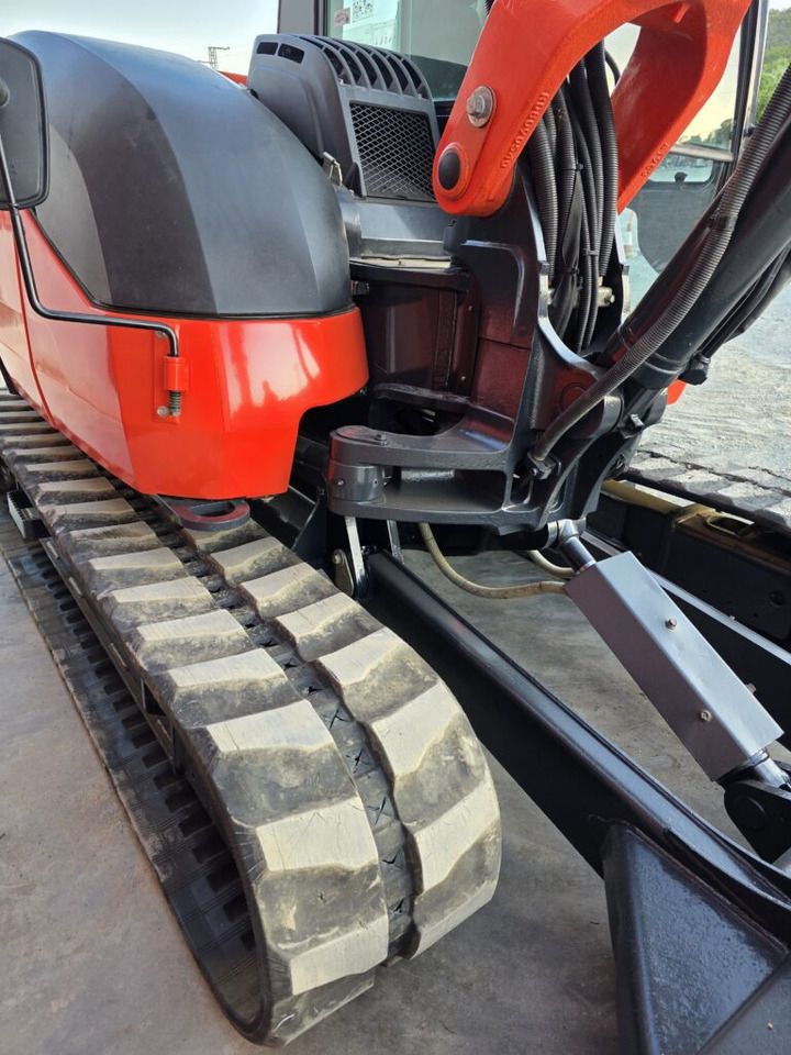 2021 Kubota KX080-4A2 mini excavator side view of the undercarriage and boom base