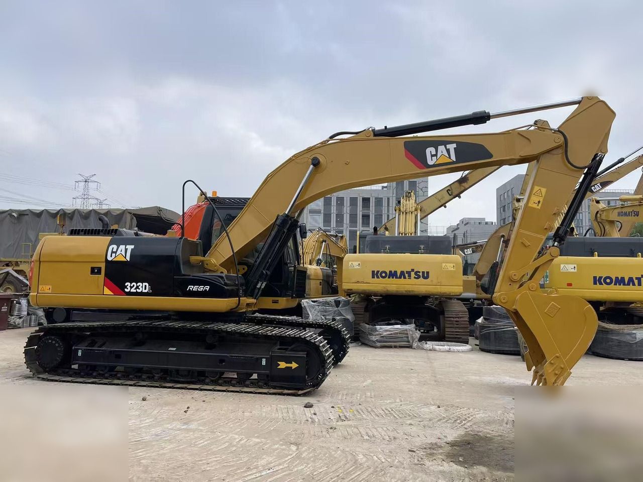 2023 Caterpillar 323DL crawler excavator, side profile view