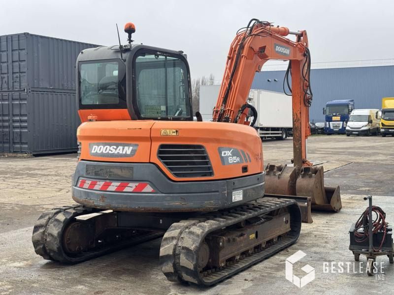 2017 Doosan DX85R-3 mini excavator, rear three-quarter view 2017 Doosan DX85R-3 mini excavator, rear three-quarter view