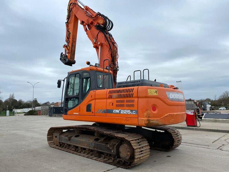 2017 Doosan DX225LC crawler excavator, rear three-quarter view 2017 Doosan DX225LC crawler excavator, rear three-quarter view