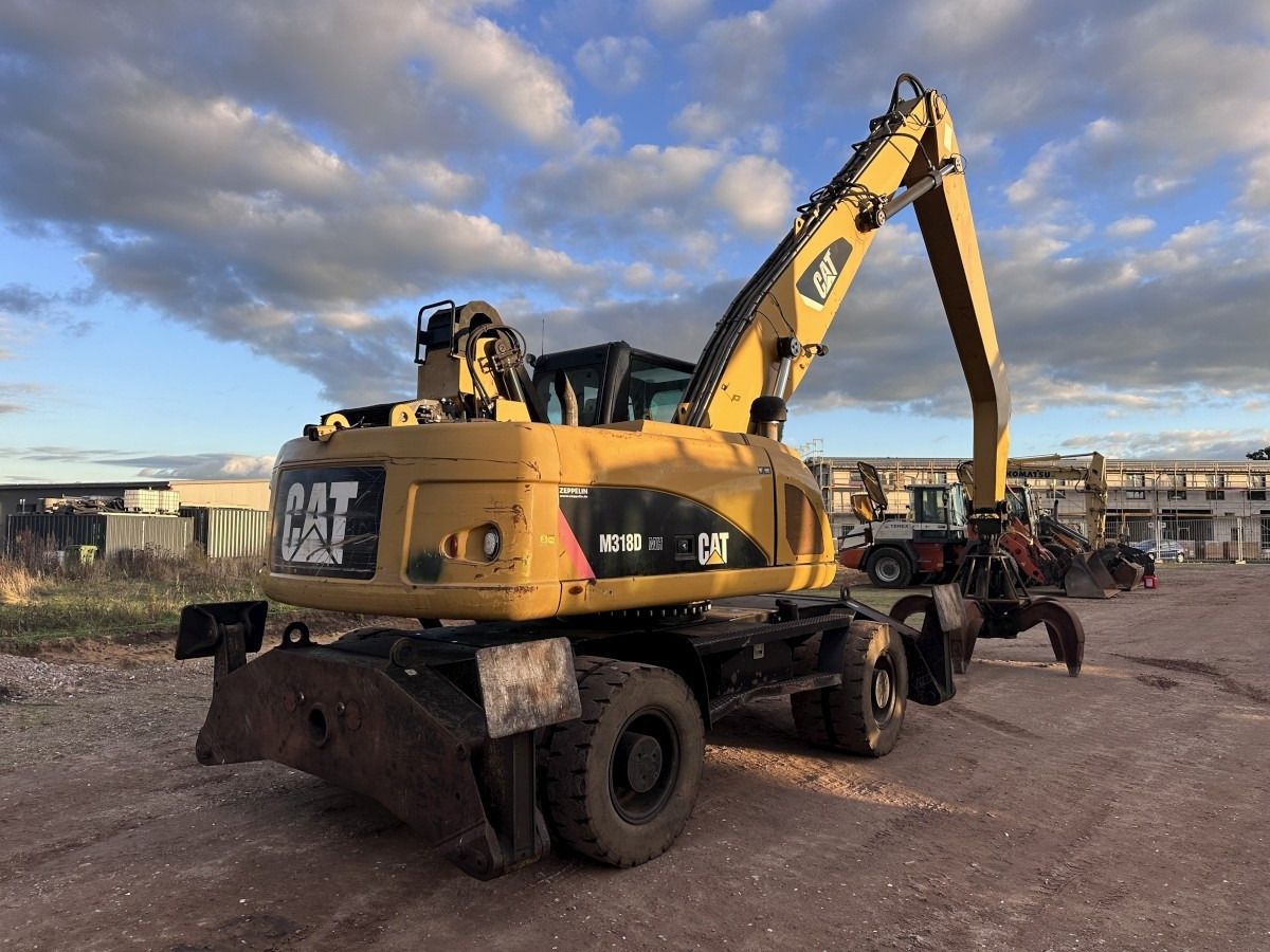 2012 Caterpillar M318D MH wheel excavator, rear three-quarter view