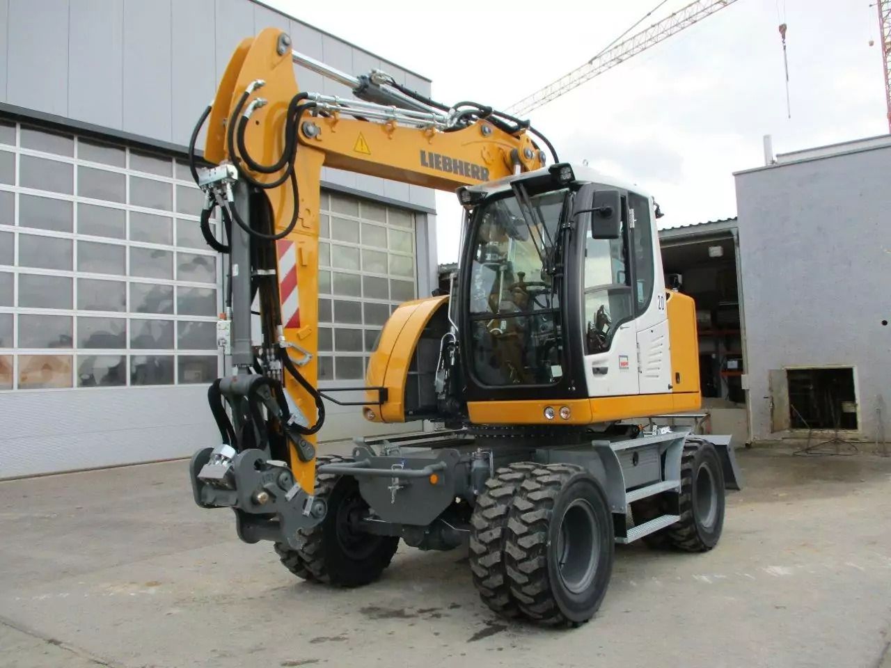 2023 Liebherr A 913 Compact wheel excavator, front three-quarter view 2023 Liebherr A 913 Compact wheel excavator, front three-quarter view