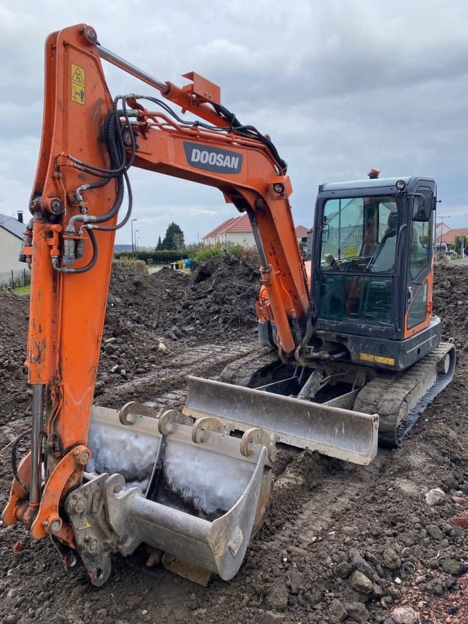 2018 Doosan DX62R-3 mini excavator, front three-quarter view 2018 Doosan DX62R-3 mini excavator, front three-quarter view