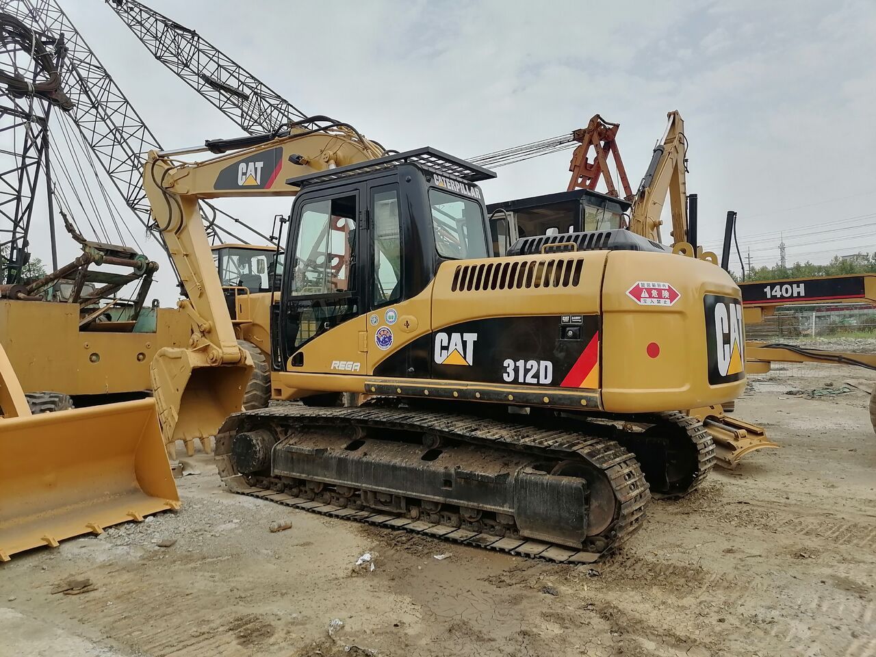 2022 Caterpillar 312D excavator, rear three-quarter view