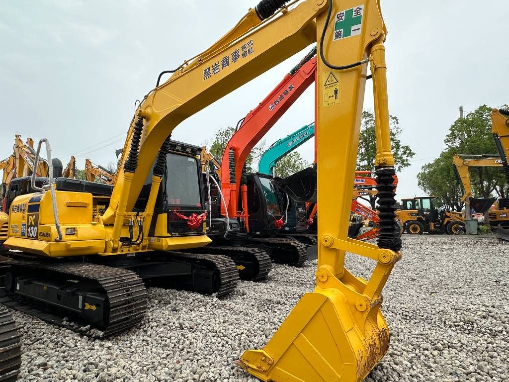 2023 Komatsu PC130 mini excavator, rear three-quarter view 2023 Komatsu PC130 mini excavator, rear three-quarter view