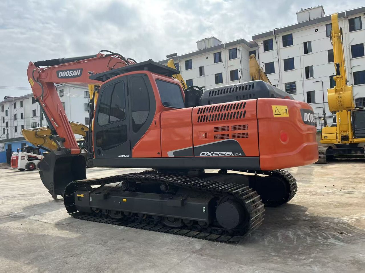 2023 Doosan DX225LCA crawler excavator, rear three-quarter view