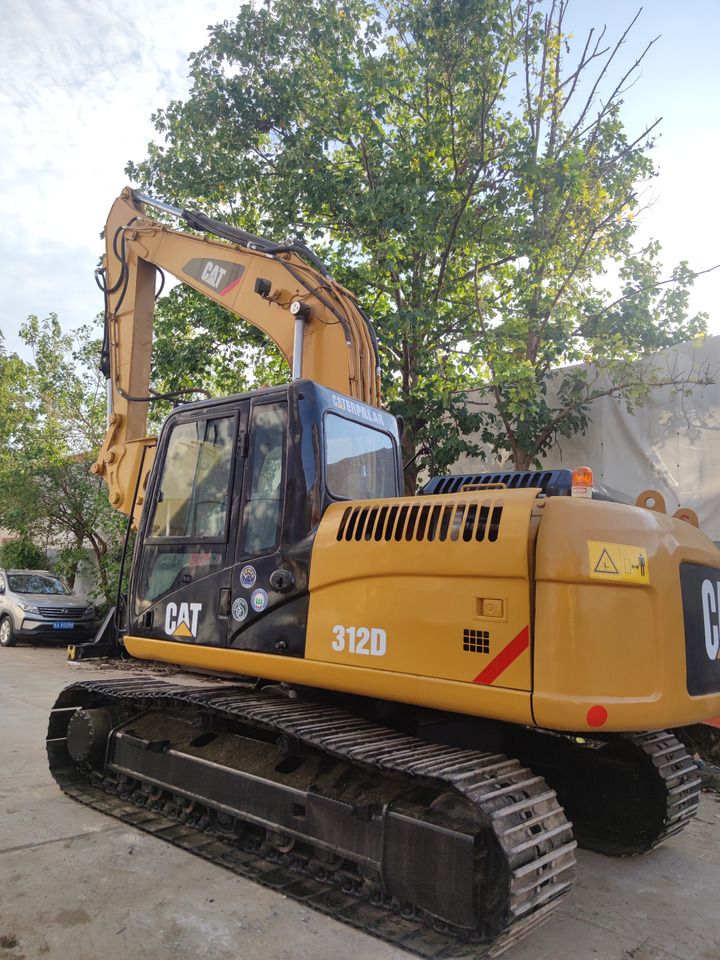Caterpillar 312D crawler excavator, side view Caterpillar 312D crawler excavator, side view