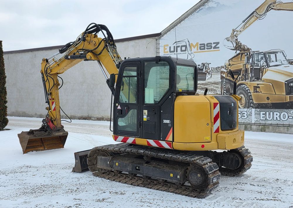 2016 Caterpillar 308E2CR crawler excavator, rear three-quarter view 2016 Caterpillar 308E2CR crawler excavator, rear three-quarter view